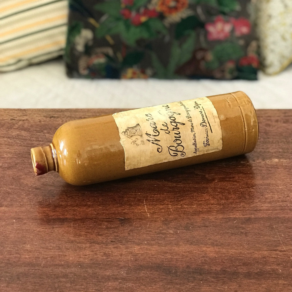 Bouteille vintage en grès marron jaune moutarde Marc de Bourgogne 1967 par Hello Broc brocante en ligne