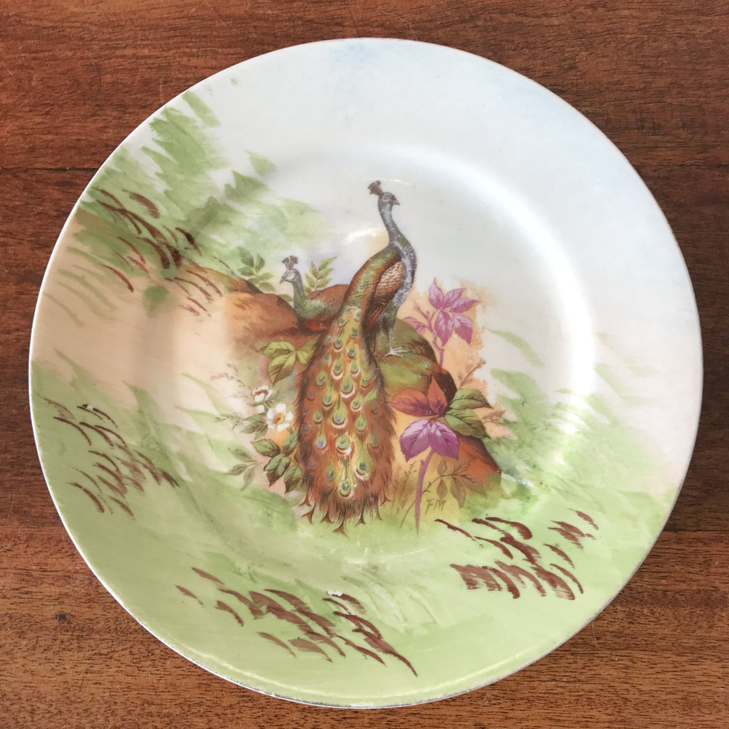 Assiette de collection murale en porcelaine de Limoges décor paons J.B.T & Cie début XXème siècle par Hello Broc brocante en ligne
