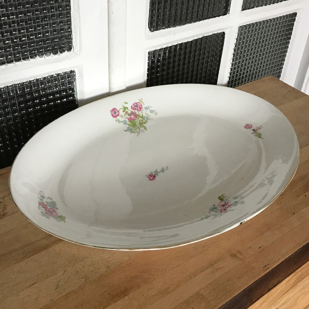 Très grand plat de service ovale et creux en porcelaine de Limoges P.L. 52 x 35 cm par Hello Broc brocante en ligne