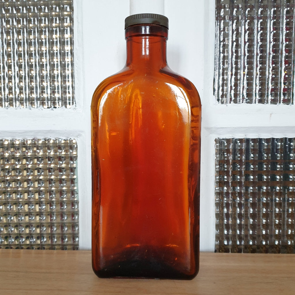 Grand flacon de médicament ancien en verre moulé ambré des Laboratoires J.L. Châtelain par Hello Broc brocante en ligne
