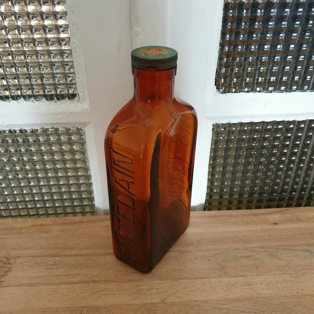 Grand flacon de médicament en verre moulé ambré des Laboratoires J.L. Châtelain - Hello Broc