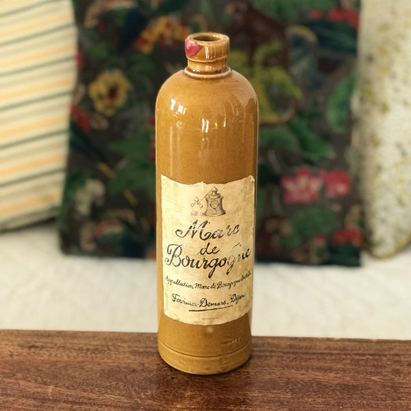 Bouteille vintage en grès marron jaune moutarde Marc de Bourgogne 1967 par Hello Broc brocante en ligne