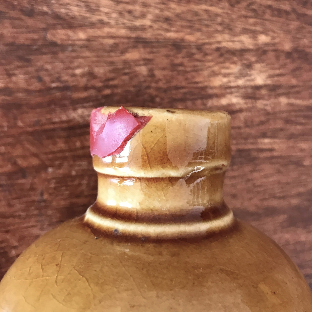 Bouteille vintage en grès marron jaune moutarde Marc de Bourgogne 1967 par Hello Broc brocante en ligne
