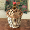 Dame-jeanne bouteille en verre ambré de 2 L Viresa dans son écrin en osier vintage par Hello Broc brocante en ligne