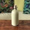 Bouteille bouillote ancienne en grès vernissé écru par Hello Broc brocante en ligne