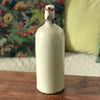 Bouteille bouillote ancienne en grès vernissé écru par Hello Broc brocante en ligne