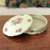 Grande boîte ronde et plate / bonbonnière ou boîte à bijoux en porcelaine de Limoges décor roses par Hello Broc brocante en ligne