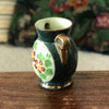 Petit vase en céramique verte avec un bouquet de fleurs en médaillon Enghien France