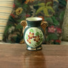 Petit vase en céramique verte avec un bouquet de fleurs en médaillon Enghien France