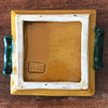 Dessous de plat ou présentoir carré en céramique jaune moutarde et vert de Vallauris A. Ferlay par Hello Broc brocante en ligne