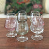 Ensemble de 7 verres à cognac vintage sur pied en verre moulé multicolores dans les tons pastels de 13 cl par Hello Broc brocante en ligne
