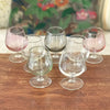 Ensemble de 7 verres à cognac vintage sur pied en verre moulé multicolores dans les tons pastels de 13 cl par Hello Broc brocante en ligne