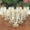 Lot de 10 petits verres à digestif ou à liqueur sur pied Art Déco en verre moulé liseré doré par Hello Broc brocante en ligne