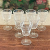 Lot de 7 verres à vin blanc ou à digestif sur pied décor arabesques attribution Luminarc contenance 6 cl par Hello Broc brocante en ligne