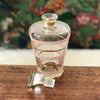 Carafon vintage années 50 décor stries granité rose et liserés dorés contenance de 0,4 litres par Hello Broc brocante en ligne