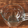 Pichet arrondi en verre moulé et gravé fleurs années 70 / 80 contenance 1 litre par Hello Broc brocante en ligne