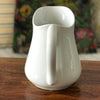Cruche en faïence blanche attribuée à Sarreguemines par Hello Broc brocante en ligne