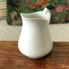 Cruche en faïence blanche attribuée à Sarreguemines par Hello Broc brocante en ligne