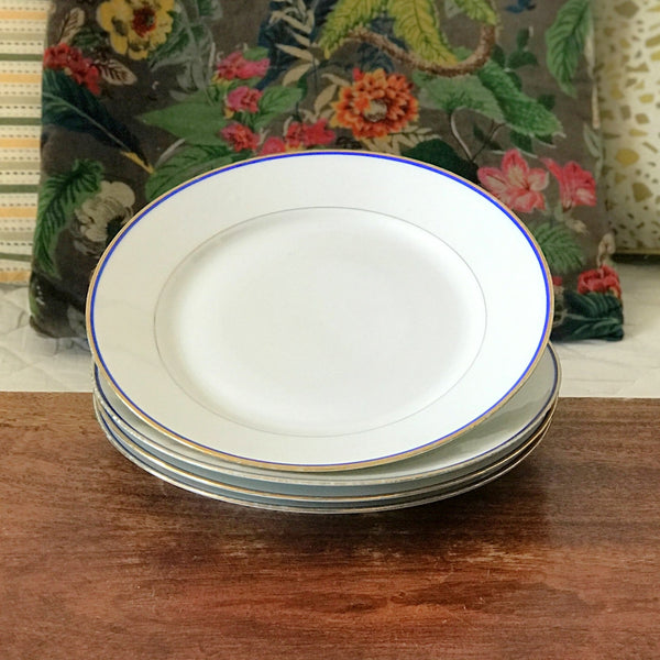 Lot de 4 assiettes plates en porcelaine blanche de Limoges liserés doré et bleu UML France par Hello Broc brocante en ligne