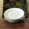 Lot de 4 assiettes plates en porcelaine blanche de Limoges liserés doré et bleu UML France par Hello Broc brocante en ligne