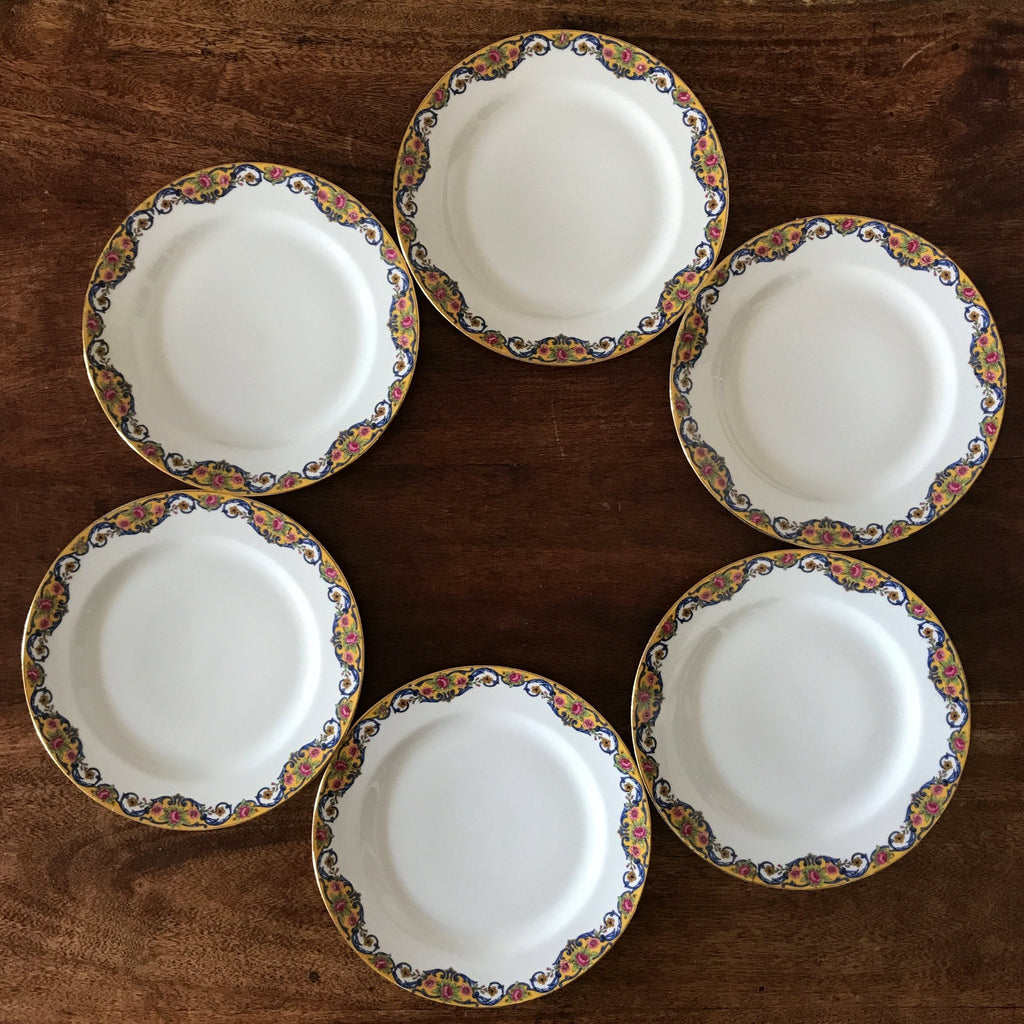 Lot de 6 assiettes à dessert en porcelaine de Limoges bordure jaune et fleurs multicolores par Hello Broc brocante en ligne