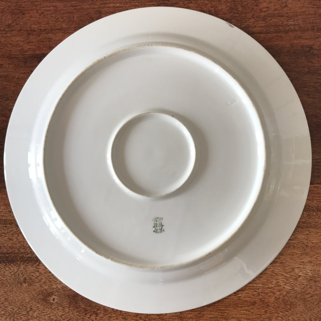 Plat de service en porcelaine de Limoges W. G. & Co pour Guérin & Co Circa 1910 1920 diamètre 31 cm par Hello Broc brocante en ligne