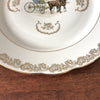Plat de service rond vintage attribution porcelaine du Berry décor central calèche et volutes dorés par Hello Broc brocante en ligne
