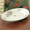 Grand plat de service ovale en porcelaine ULIM Limoges France à décor pavots longueur 40 cm par Hello Broc brocante en ligne