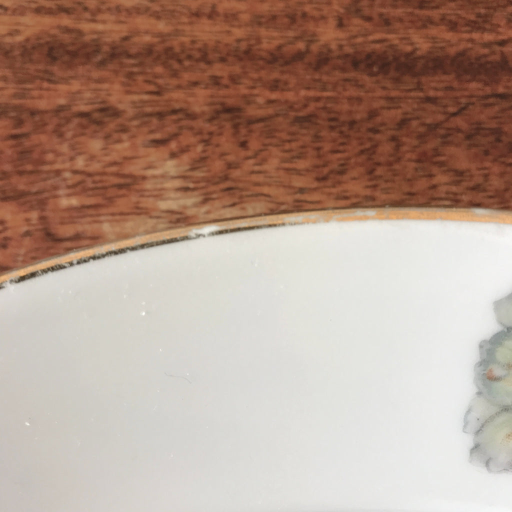 Plat rond légèrement creux en porcelaine de Limoges décor pavots diamètre de 29 cm