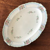 Plat de service ovale en porcelaine de Limoges Lanternier décor fleurs et bleu par Hello Broc brocante en ligne