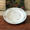 Plat de service rond en porcelaine de Limoges Lanternier décor fleurs et bleu diamètre de 33 cm par Hello Broc brocante en ligne
