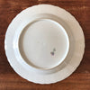 Plat de service rond en porcelaine de Limoges Lanternier décor fleurs et bleu diamètre de 33 cm par Hello Broc brocante en ligne