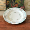 Plat de service rond en porcelaine de Limoges Lanternier décor fleurs et bleu diamètre de 33 cm par Hello Broc brocante en ligne