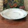 Plat de service rond en porcelaine de Limoges Lanternier décor fleurs et bleu diamètre de 33 cm par Hello Broc brocante en ligne