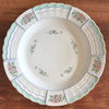 Plat de service rond en porcelaine de Limoges Lanternier décor fleurs et bleu diamètre de 33 cm par Hello Broc brocante en ligne
