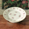 Présentoir à gâteau vintage sur piédouche en porcelaine de Limoges décor fleurs par Hello Broc brocante en ligne