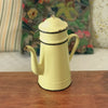 Cafetière ancienne décorative émaillée en métal couleur jaune pâle par Hello Broc brocante en ligne