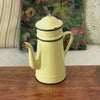 Cafetière ancienne décorative émaillée en métal couleur jaune pâle par Hello Broc brocante en ligne