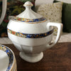 Service à café vintage en porcelaine Victoria China Czechoslovakia décor frise florale sur fond bleu par Hello Broc brocante en ligne
