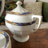 Service à café vintage en porcelaine Victoria China Czechoslovakia décor frise florale multicolore sur fond bleu par Hello Broc brocante en ligne