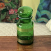 Ancien bocal à café vintage en verre moulé vert et frises imprimées dorées par Hello Broc brocante en ligne