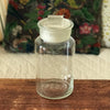 Bocal ancien en verre soufflé avec son couvercle au bouton de préhension rectangulaire par Hello Broc brocante en ligne