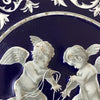 Boîte ronde en métal bleu embossé décoré d'anges blancs