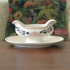 Saucière sur piédouche Digoin Sarreguemines décor Printemps par Hello Broc brocante en ligne