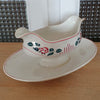 Saucière sur piédouche Digoin Sarreguemines décor Printemps par Hello Broc brocante en ligne