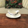 Saucière sur piédouche Digoin Sarreguemines décor Printemps par Hello Broc brocante en ligne