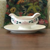 Saucière sur piédouche Digoin Sarreguemines décor Printemps par Hello Broc brocante en ligne