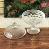 Sucrier bonbonnière sur pied en verre moulé incolore décor fruits et feuillages par Hello Broc brocante en ligne