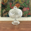 Sucrier bonbonnière sur pied en verre moulé incolore décor fruits et feuillages par Hello Broc brocante en ligne