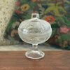 Sucrier bonbonnière sur pied en verre moulé incolore décor fruits et feuillages par Hello Broc brocante en ligne